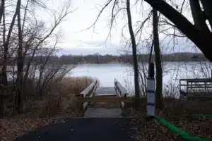 Signs at a lake near Dr. Hansen’s Minnesota home warn of PFAS contamination in fish.